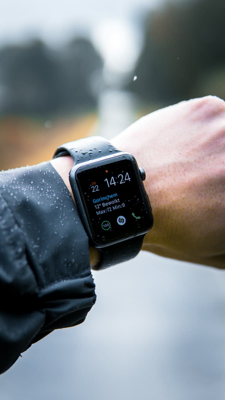Preloved Apple Watch Space Gray with black sport band in the rain
